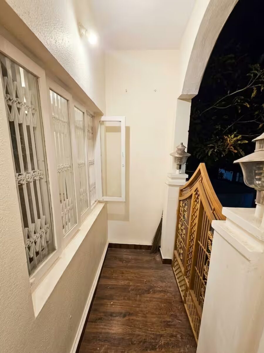 Arched balcony corridor lit up at night