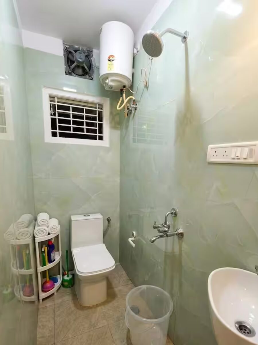 Clean modern bathroom with hot water geyser