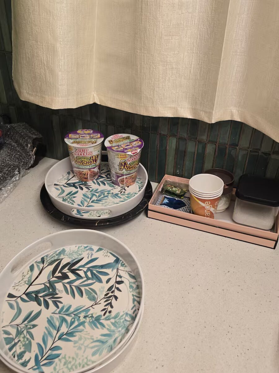 Ceramic tray with mugs and bowls for breakfast